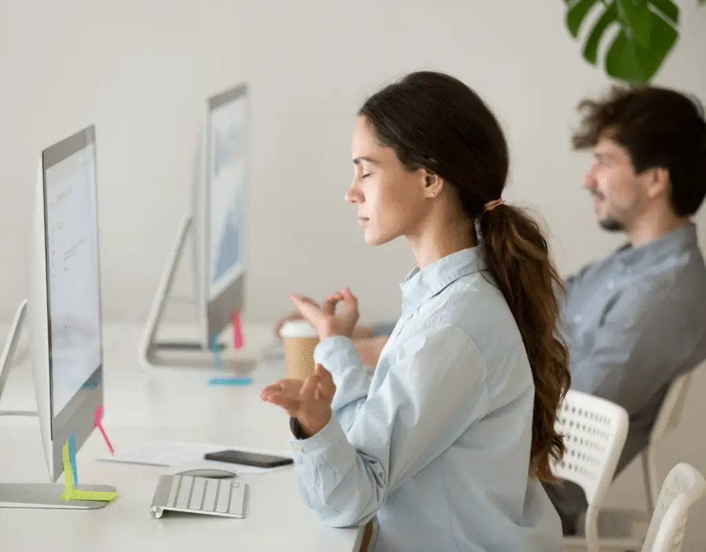 Woman practicing mindfulness at her desk