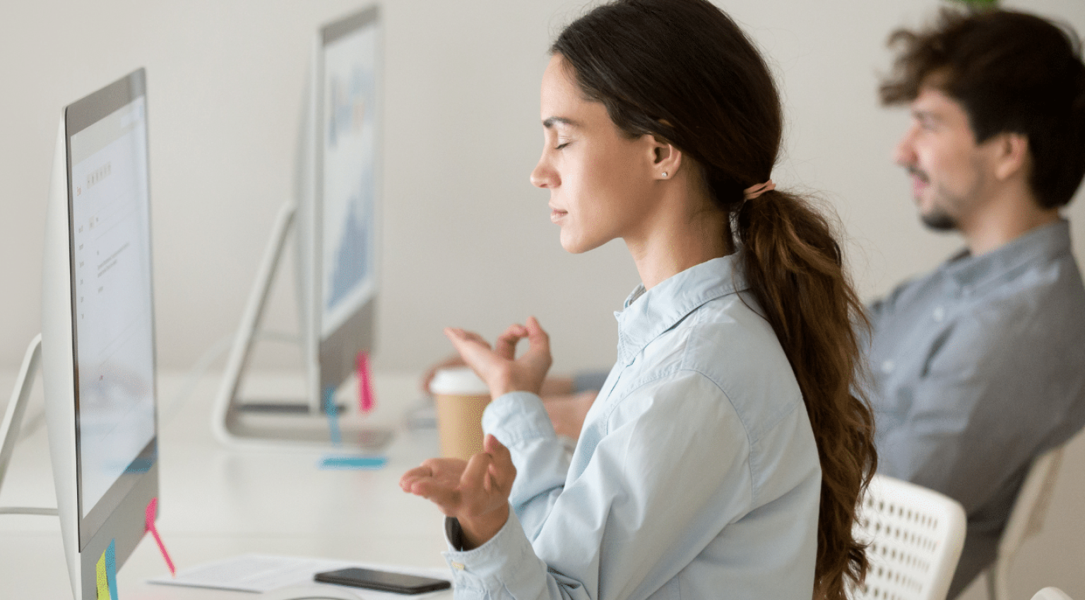 Woman practicing mindfulness at her desk