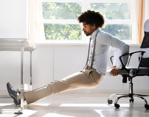 Man doing chair yoga at work